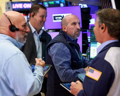 Wall St opens higher after jobs data, chip rebound