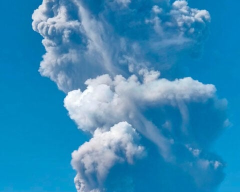 Indonesian rescuers find 1 body after volcano eruption as search continues for 2 more