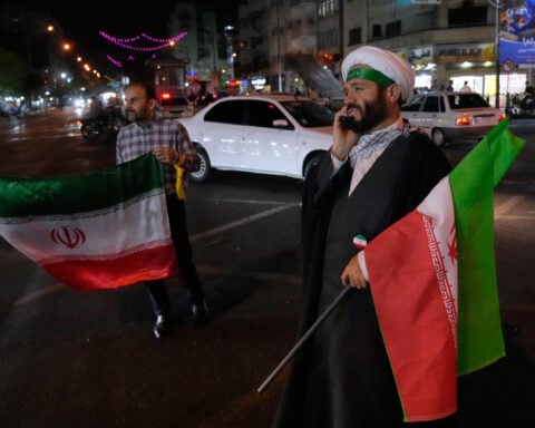 Iran warns the US against attacks on its oil tankers and other ships but ceasefire appears to hold