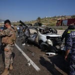 Israeli drone strikes near Beirut kill 4 and southern airstrikes kill at least 13
