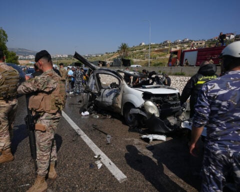 Israeli drone strikes near Beirut kill 4 and southern airstrikes kill at least 13