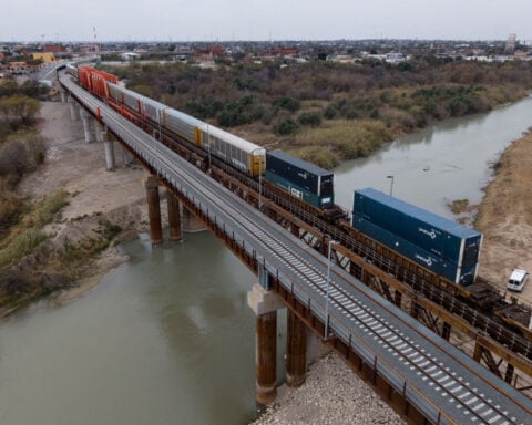 Heat stroke is suspected among 6 found dead in a shipping container at a rail yard near Texas border