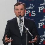 Former Polish justice minister who faces prosecution at home says he's traveled from Hungary to US