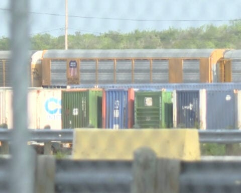 Heat stroke is suspected among 6 found dead in a shipping container at a rail yard near Texas border