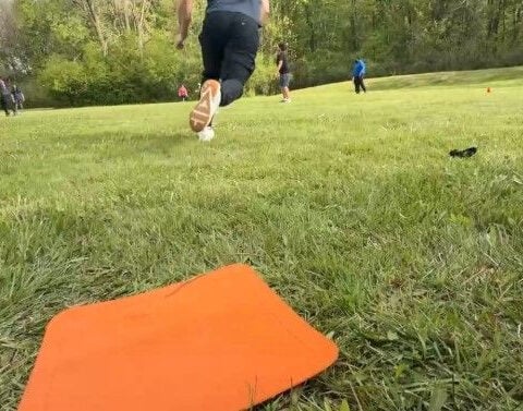 Police and firefighters play kickball with foster children to build trust