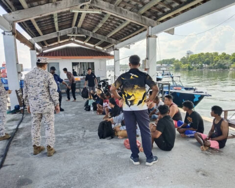 Malaysia searches for 14 missing after migrant boat capsizes