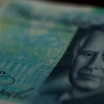 Who are the 'bond vigilantes' exacting a price from Britain's government?