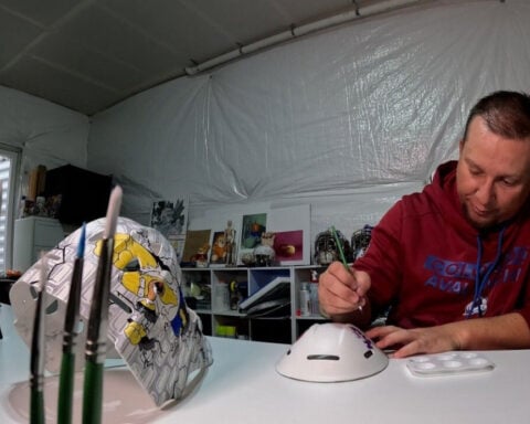 A whole lot of heart: Teacher turns masks into works of art for former students
