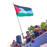 Barcelona star Lamine Yamal waves Palestinian flag during title parade