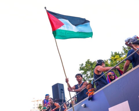 Barcelona star Lamine Yamal waves Palestinian flag during title parade