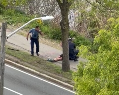 Man with assault rifle wildly shoots at drivers near Boston, wounding 2, officials say
