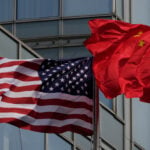 The Latest: Trump arrives in China to meet with Xi in Beijing