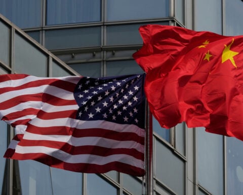 The Latest: Trump arrives in China to meet with Xi in Beijing