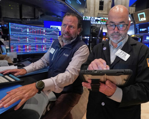 Tech carries Wall Street to records, even as most stocks fall after discouraging inflation data