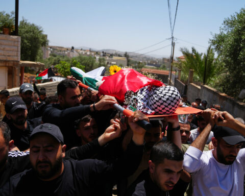 Palestinian man shot dead while climbing West Bank barrier into Israel in search of work