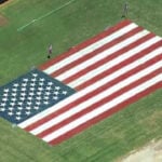 Family paints American flag in yard to celebrate 250 years of independence