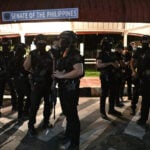 Philippine president calls emergency meeting after chaos and shooting at Senate
