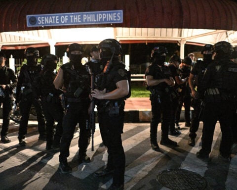 Philippine president calls emergency meeting after chaos and shooting at Senate