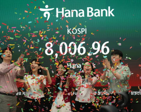 Asian stocks are lower after South Korea's Kospi hits records, as Trump wraps up Beijing trip