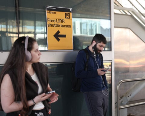Riders navigate the first weekday of a strike that has shut down the largest US commuter rail system