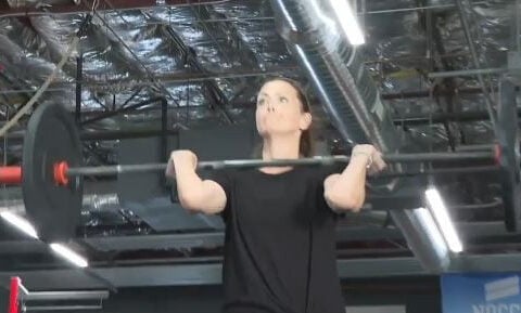 Woman rebuilds strength after cancer through CrossFit