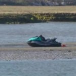 Men rescued after struggling to swim to shore
