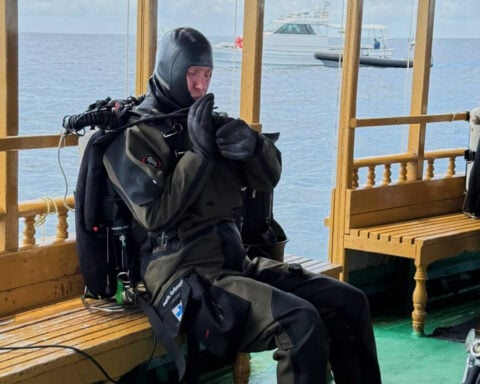Finnish divers recover 2 of the dead Italians from an underwater cave in the Maldives