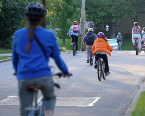 Parents, kids ride ‘bike bus’ to school for fitness, fun and safety