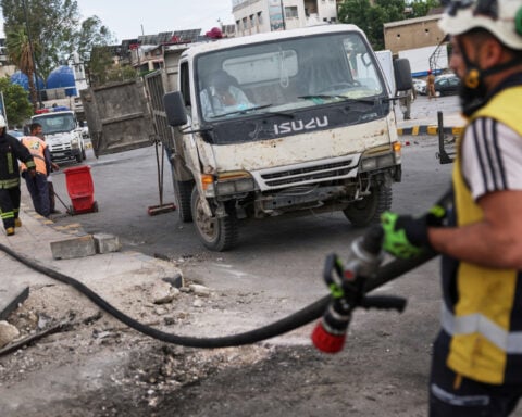 Blast outside a Syrian defense ministry building kills a soldier, wounds 12 people