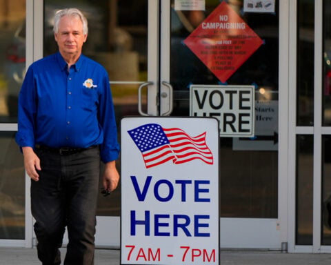 The Latest: Kentucky polls begin to close as Massie faces Trump-backed challenger