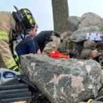 Firefighters free woman pinned by large stone