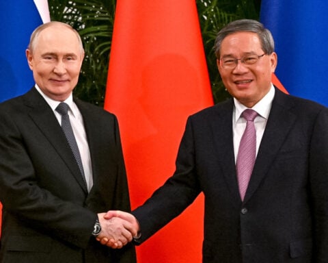 Putin and Xi hail their friendship and growing energy trade at their meeting in Beijing