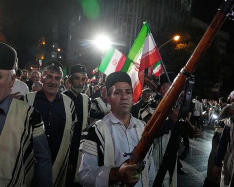 In Iran's capital, weapons demonstrations send a signal at home and abroad as threat of war remains