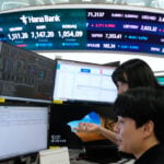 Asian shares surge after oil prices slip and Wall Street resumes its AI rally