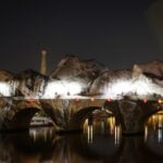 French artist JR begins his giant ‘cave’ art inflation over Paris’ oldest bridge