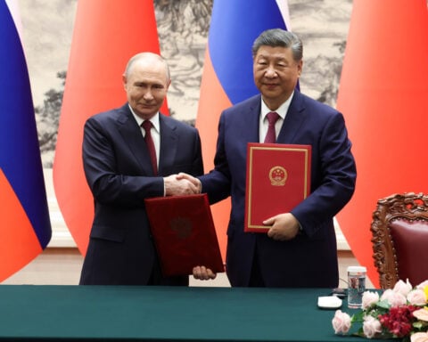 The differences — and similarities — in the Trump and Putin visits to China