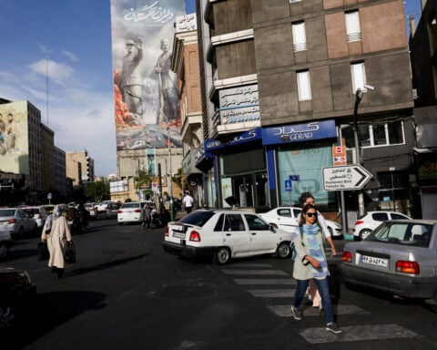 Iran propaganda push seeks to project unity despite internal divisions