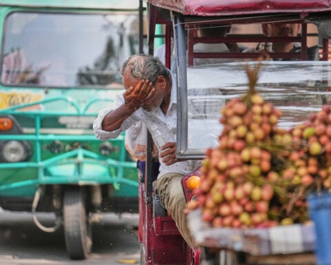 Heat wave empties roads and markets in north India as some farmers turn to nighttime work