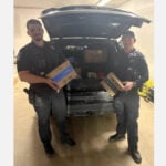 Amazon driver quits mid-shift and throws packages into street, so police officers finish her route