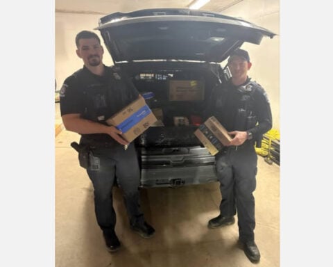 Amazon driver quits mid-shift and throws packages into street, so police officers finish her route
