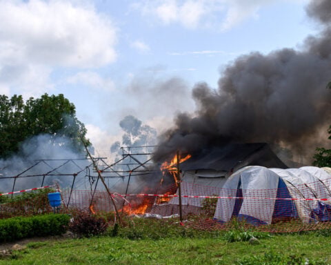 Residents burn an Ebola treatment center in Congo as anger grows over the outbreak
