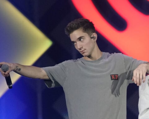Ex-girlfriend of boy band member charged with trying to hire a hitman to kill him