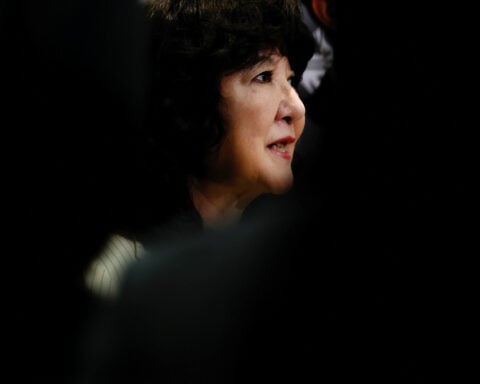 Japan will avoid over-reliance on debt for extra budget, finance minister says