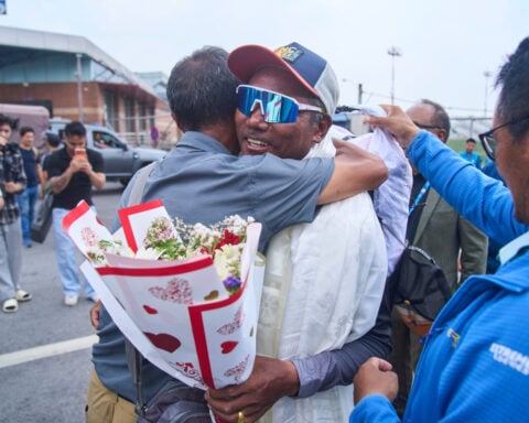 Everest record-holder Kami Rita Sherpa urges limit on climbers as crowds swell on the peak