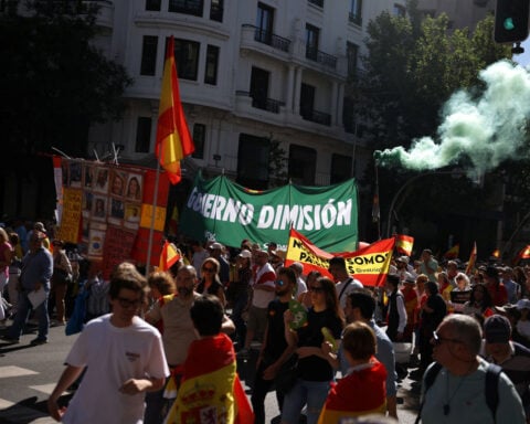Tens of thousands march in Madrid to demand prime minister's resignation