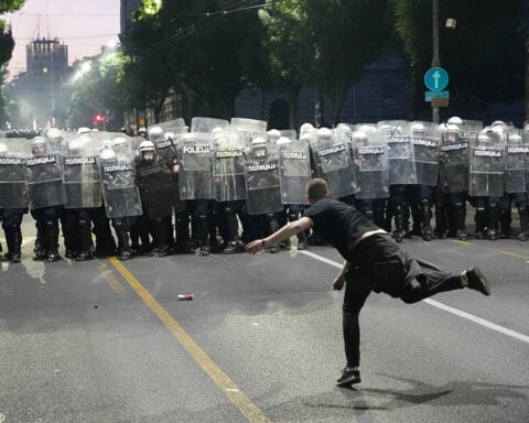 Protesters clash with police after an anti-government rally in Serbia's capital