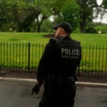 Suspect 'down' after shooting at officers near White House, official says
