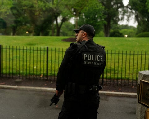 Suspect 'down' after shooting at officers near White House, official says