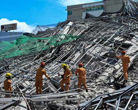 At least one dead in Philippine building collapse, 21 people missing
