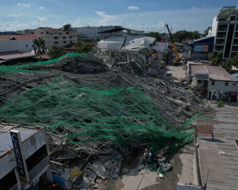 Building under construction in Philippines collapses, leaving 1 dead and 21 trapped